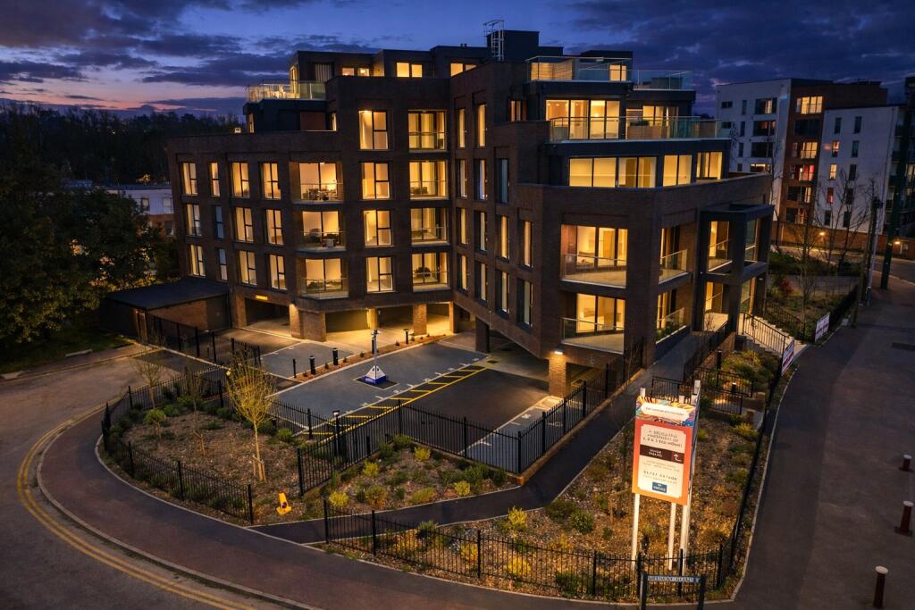 Kent acquisition, residential block exterior at dusk
